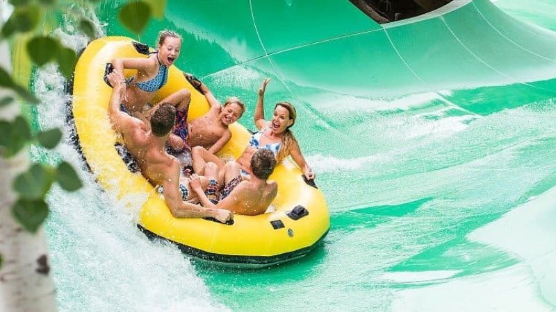 Group having a blast on slide